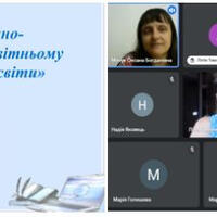 головна